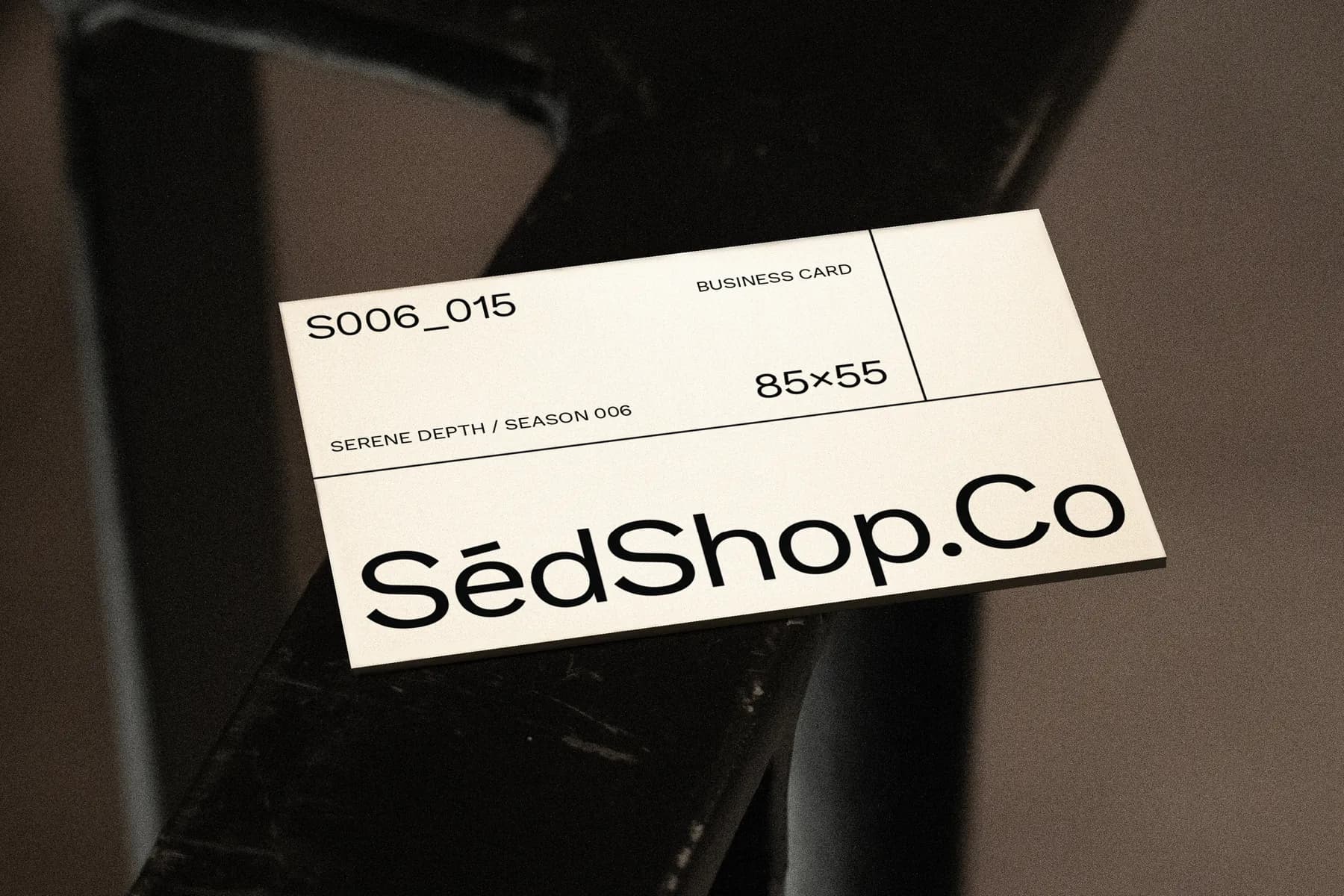 Business card mockup on dark metal surface, displaying design code S006_015 with 85x55 dimensions.