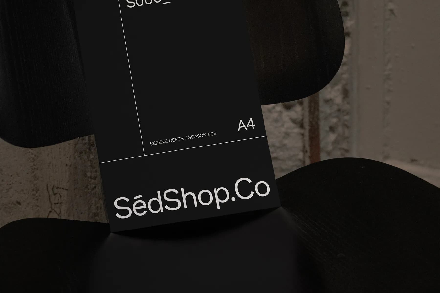 Close-up of A4 poster mockup on a chair, displaying design code S006_016 and Serene Depth / Season 006 text.
