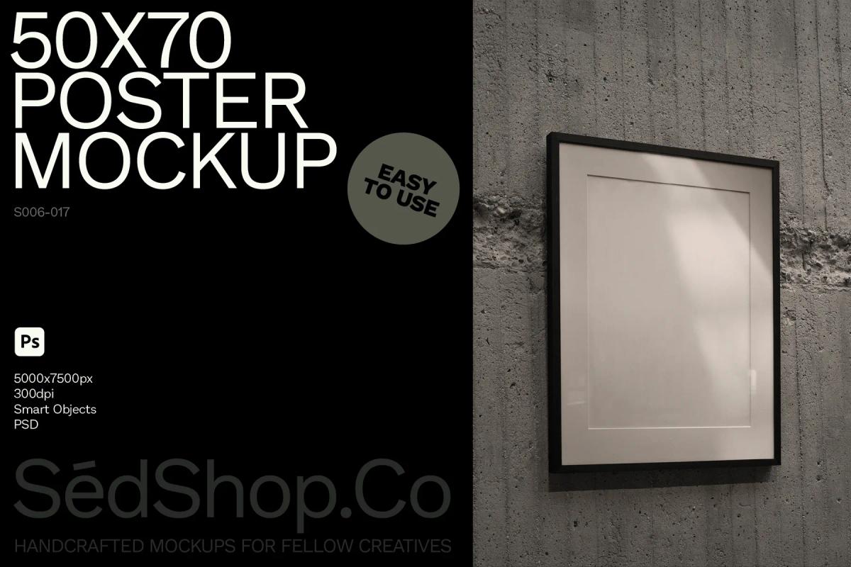 Mockup of an empty 50x70 poster frame on a concrete wall, emphasizing the blank canvas ready for customization with smart objects.