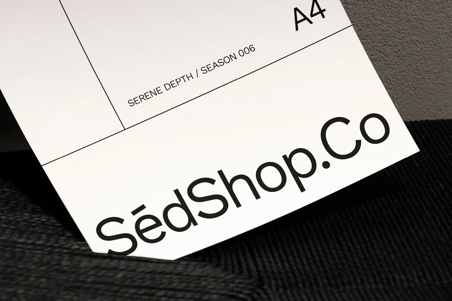 Close-up of the lower section of an A4 poster mockup, focusing on the SédShop.Co branding and sleek, clean lines.