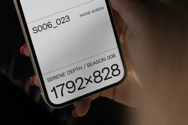 Close-up of a hand holding a phone with a mockup screen displaying 1792x828 resolution, focusing on screen details for design previews.