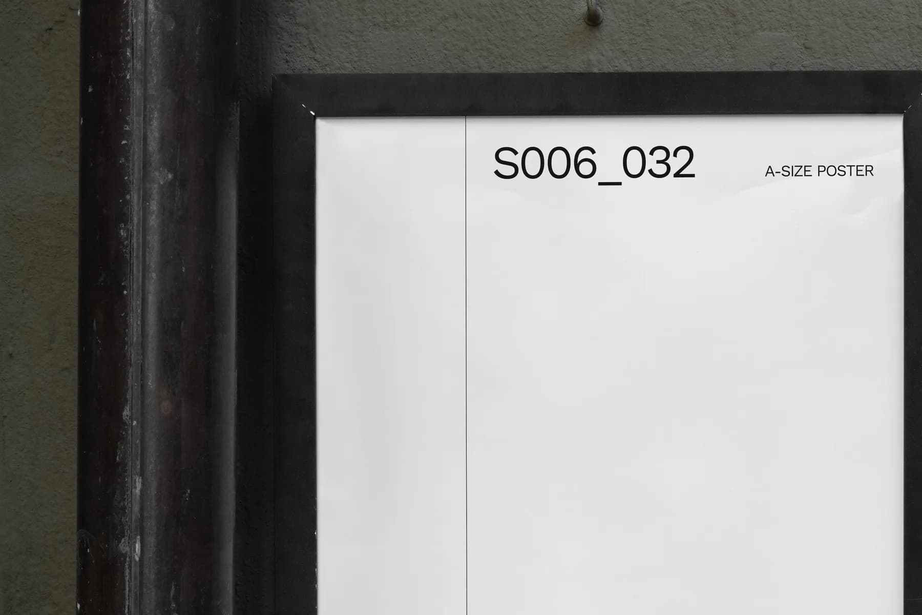 Detailed view of a blank A2 poster mockup on an exterior wall, framed in black and ready for customization.